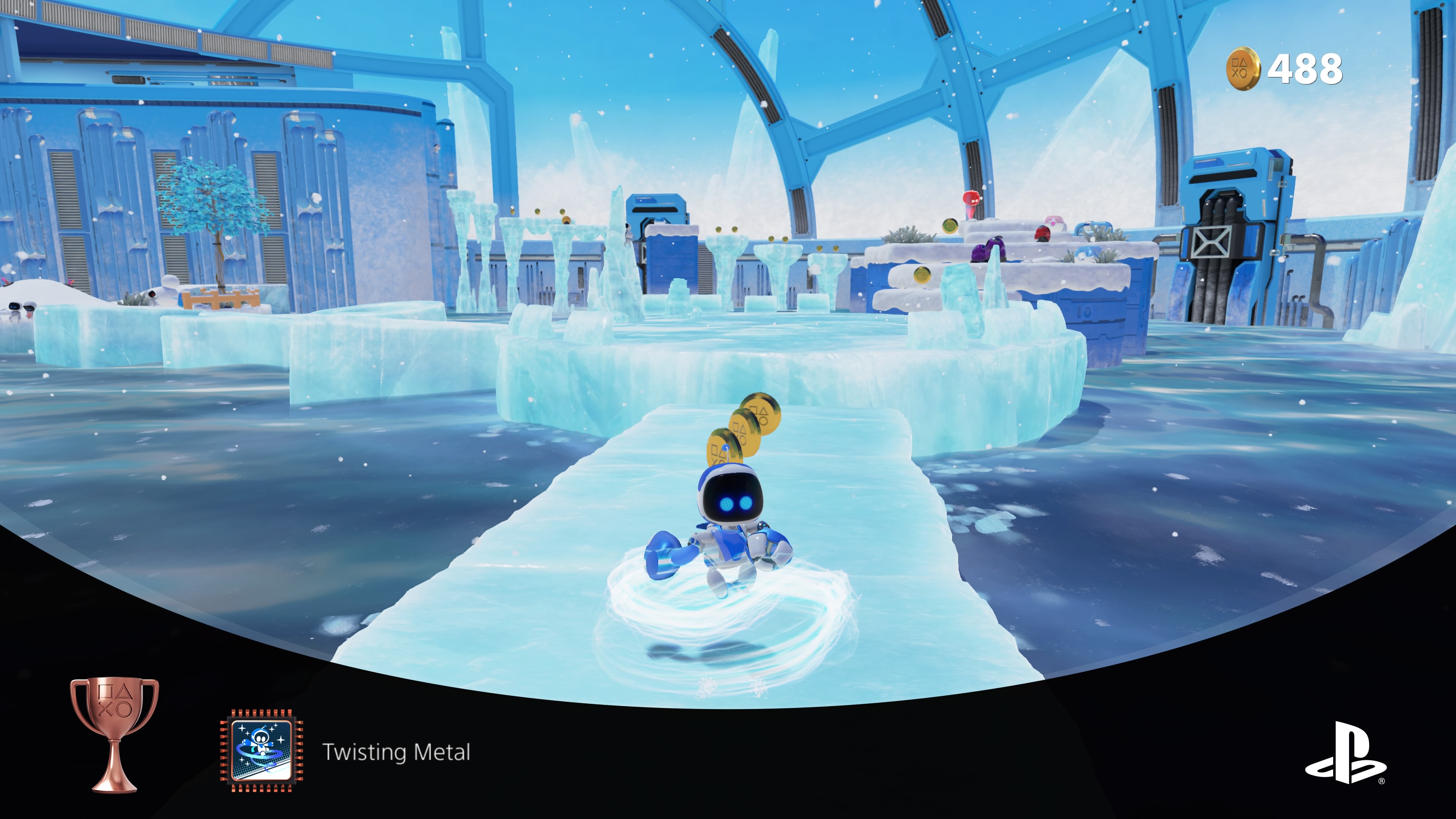 A screenshot of the game Astro's Playroom. It's a frozen level with ice blocks to walk on and freezing water below.