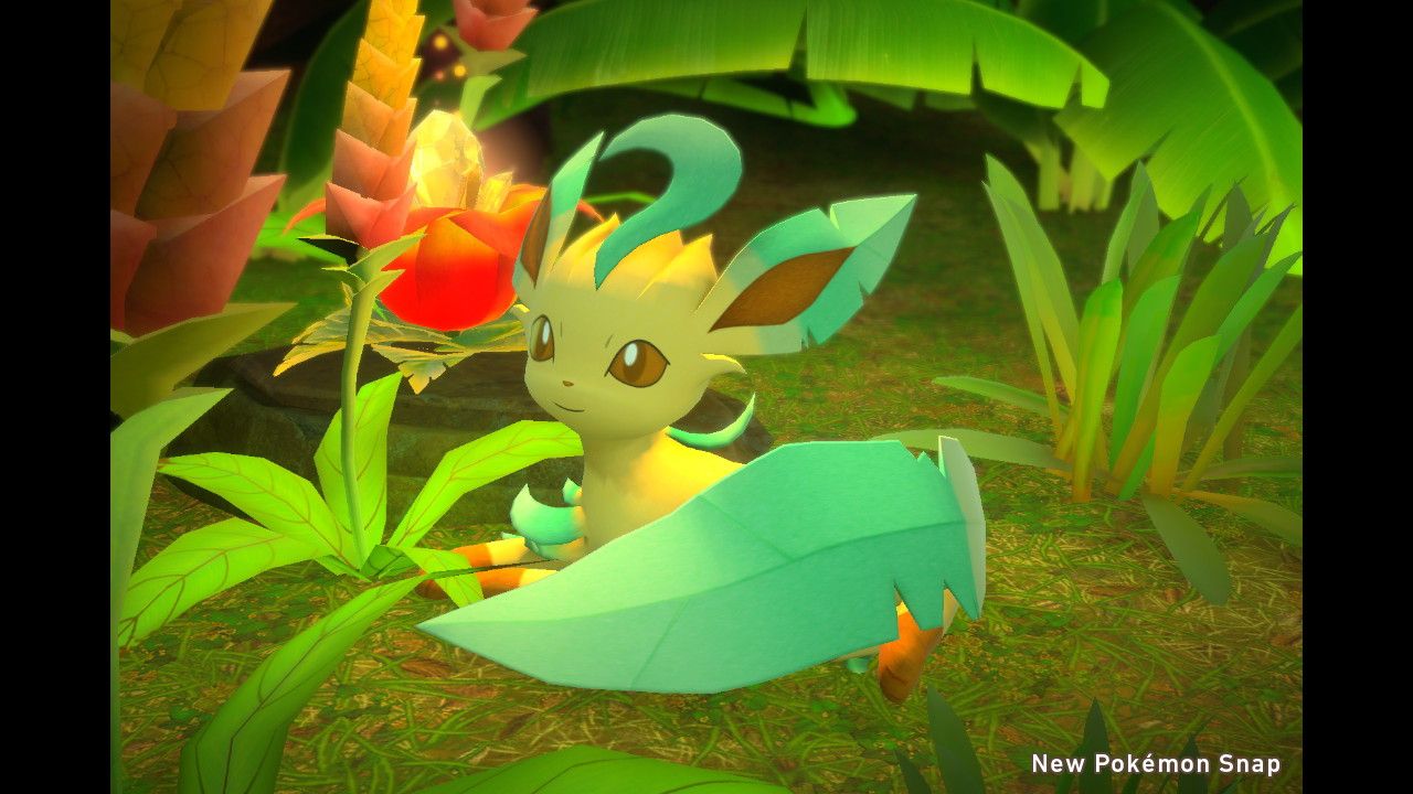 A Leafeon laying down next to a glowing flower.